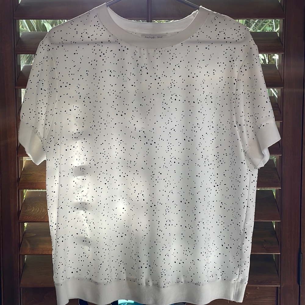 White and black spotted “sweater-blouse.”